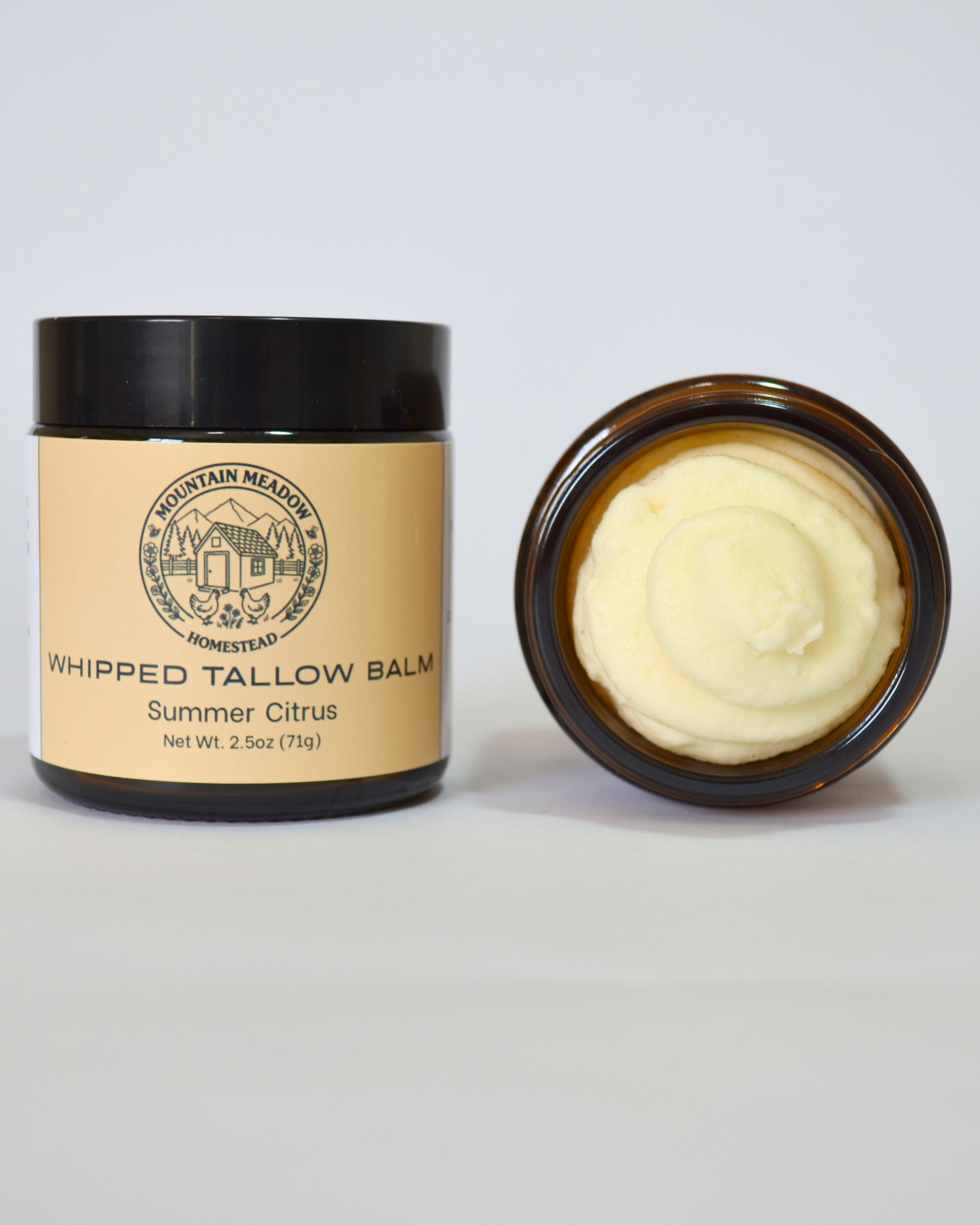 Summer Citrus Whipped Tallow Balm Inside View. Amber Jar with black lid and yellow label. Creamy