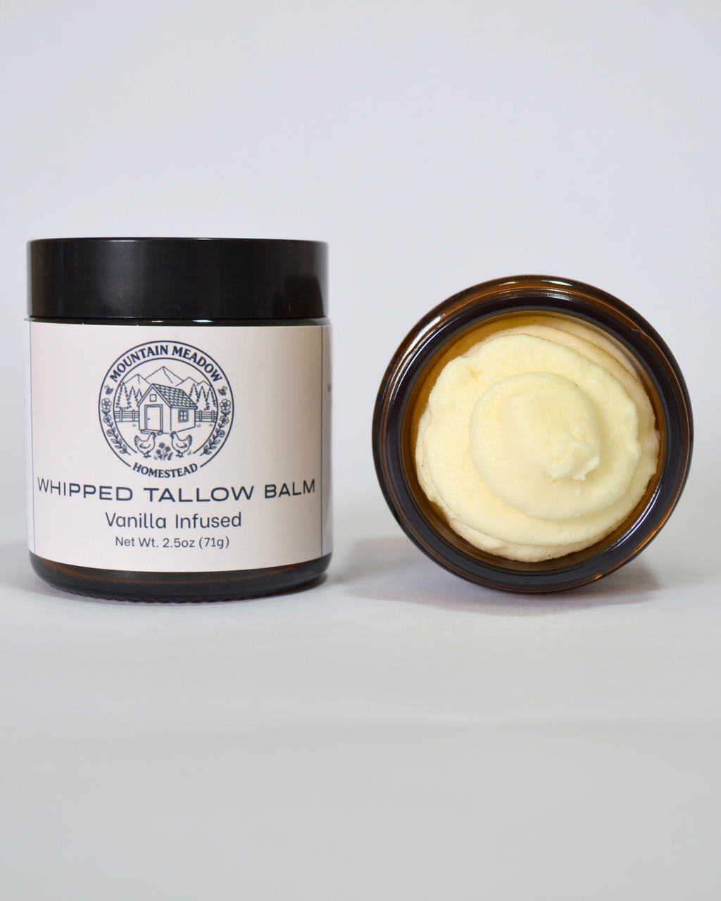 Vanilla infused Whipped Tallow Balm inside View. Amber Jar with black lid and tan label. Creamy tallow