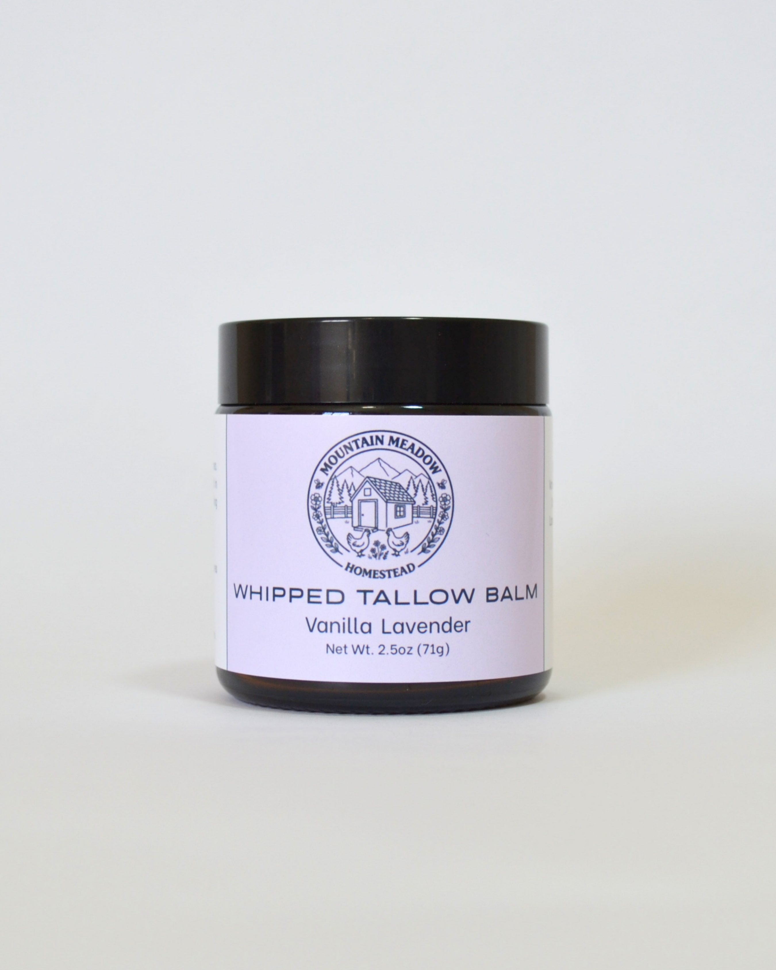 Vanilla Lavender Whipped Tallow Balm Front View. Amber Jar with black lid and  light Purple label