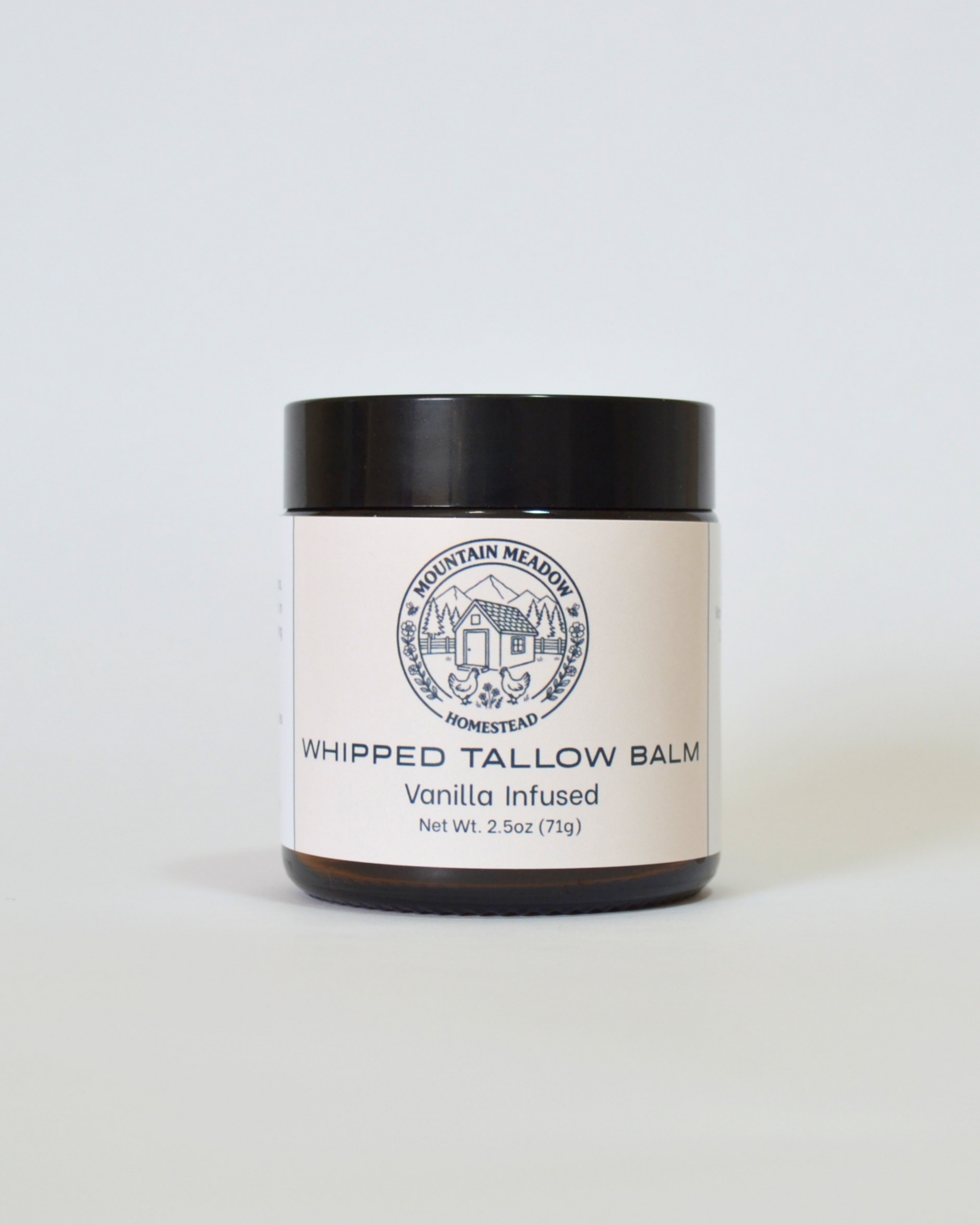 Vanilla infused Whipped Tallow Balm Front View. Amber Jar with black lid and tan label